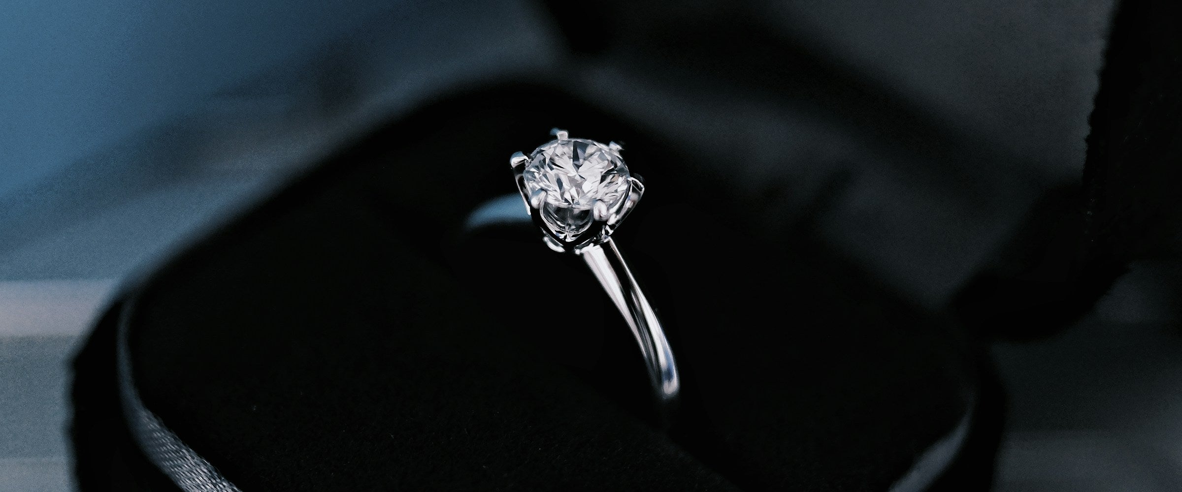 Diamond solitaire engagement ring in a velvet box